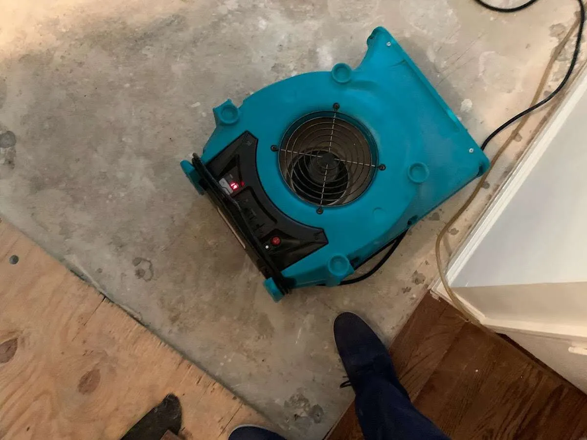 Air mover drying subfloor during Leak Detection & Repair in Upper