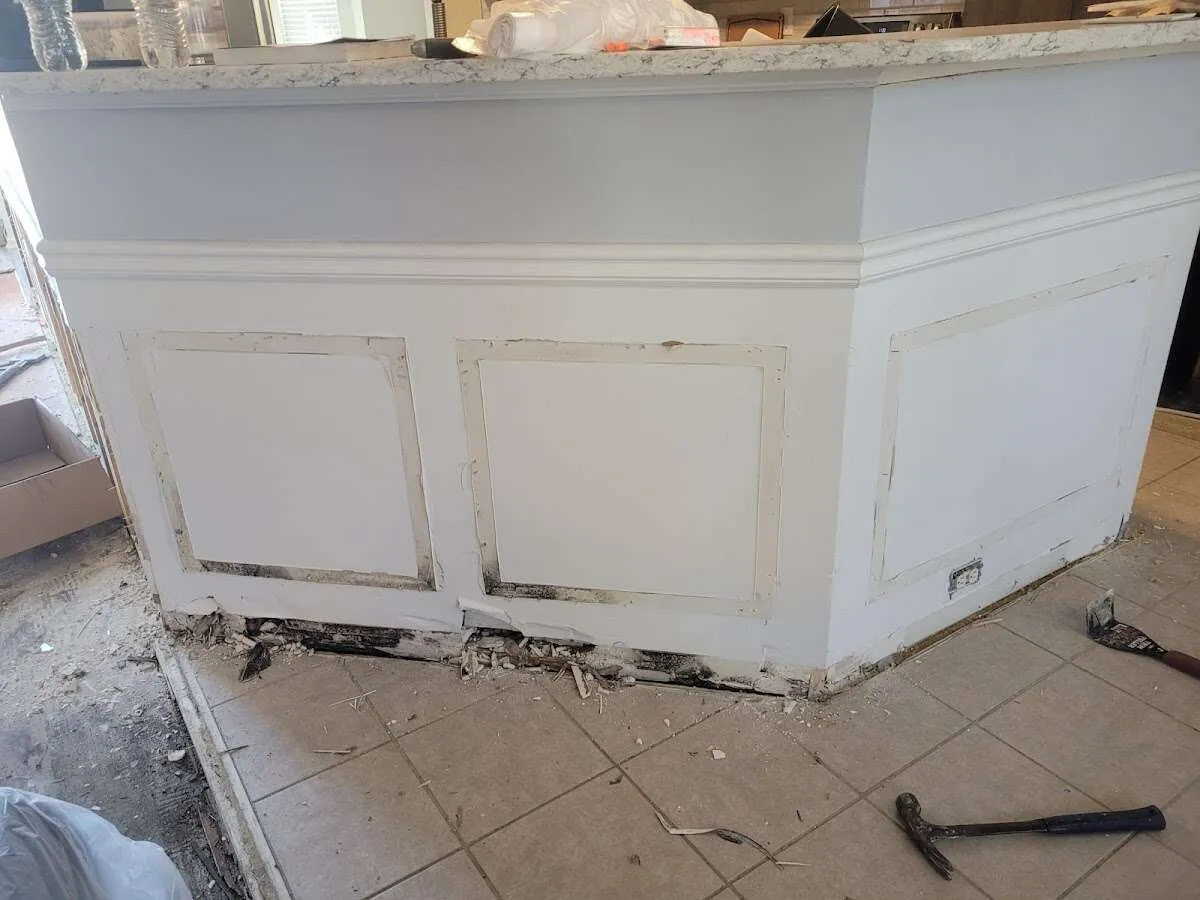 Water damage and mold on kitchen during Storm Damage Restoration in Upper